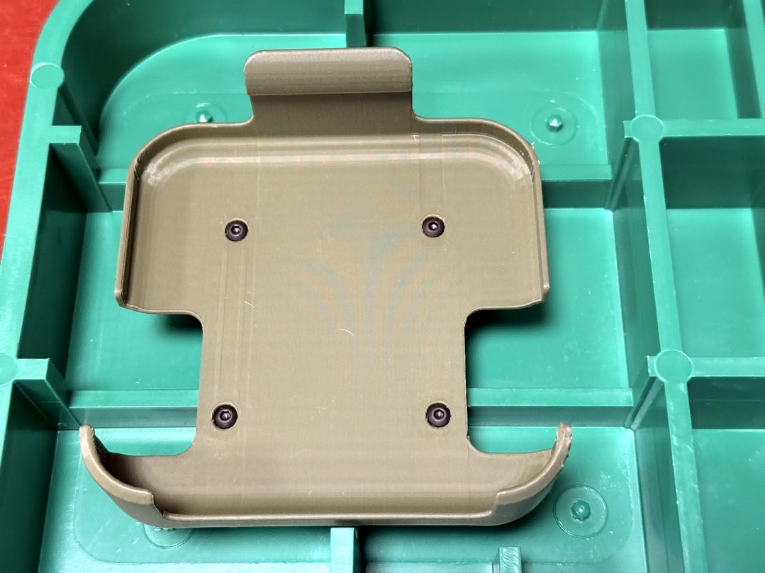 Four standoffs viewed from underside of lid